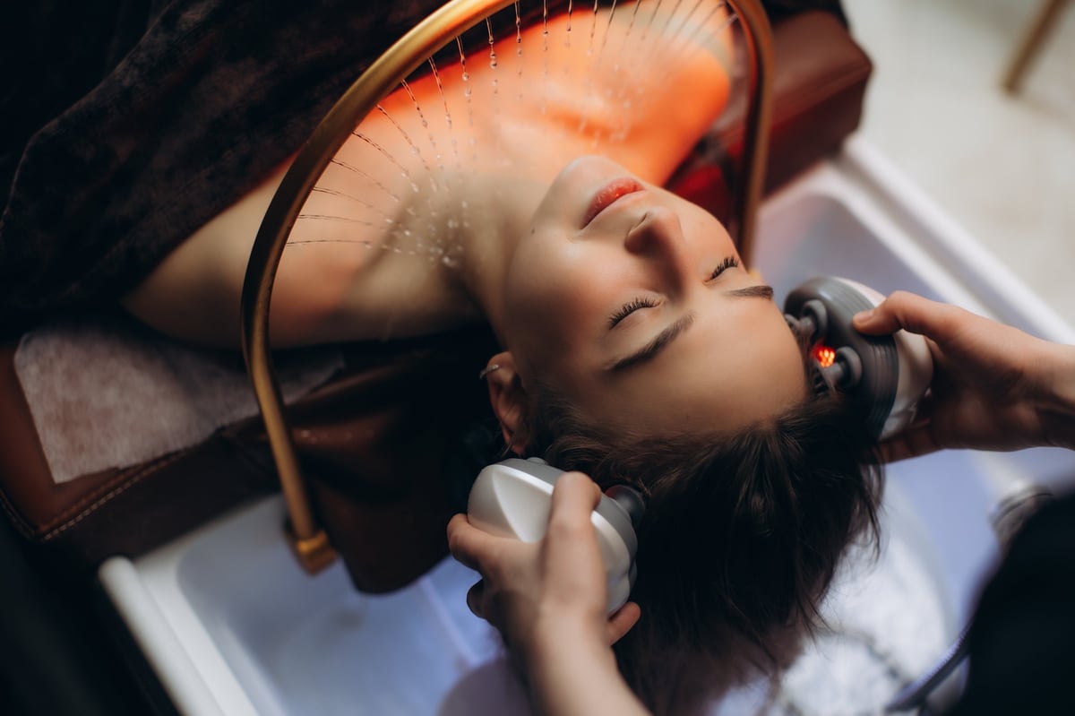 Client enjoying a relaxing scalp massage during a head spa treatment